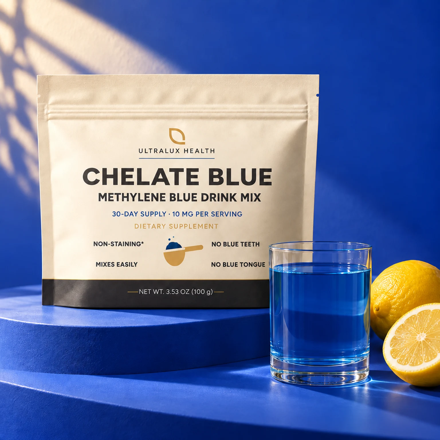 Chelate Blue cream pouch beside a prepared blue drink and fresh lemons against a cobalt backdrop